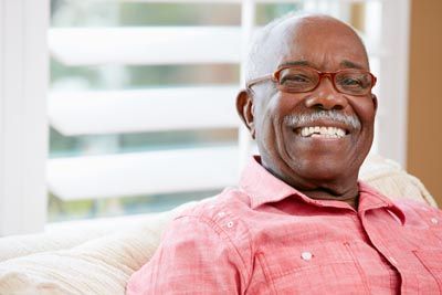 man showing off his smile after getting all-on-4 dental implants