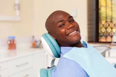 man smiling after his cosmetic dentistry appointment at Clementon Family Dentistry