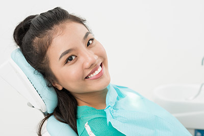 woman smiling during her dental appointment at Clementon Family Dentistry